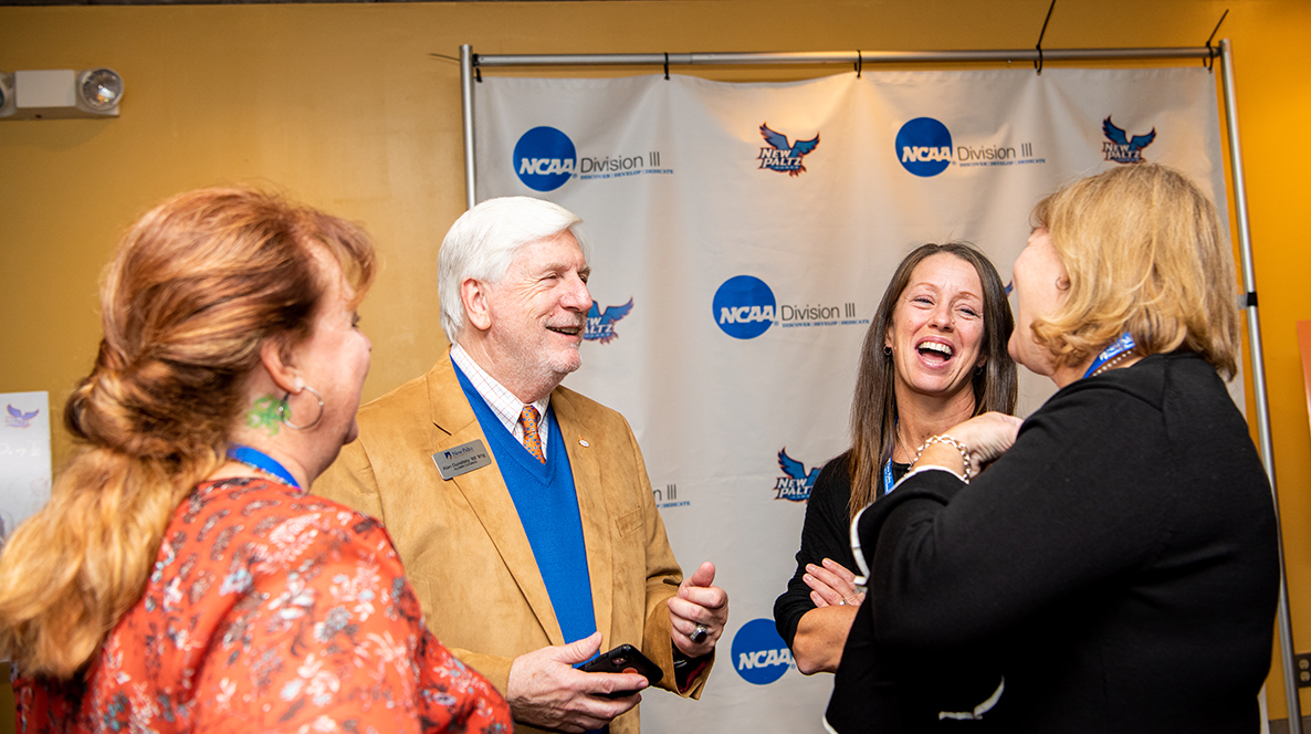 team members and coach at reunion